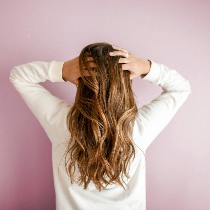 Lived-in brunette balayage with hand-painted highlights by Jasmine Rivera in Tampa